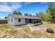 Exterior view of home with screen patio and fenced backyard at 112 E Marland Ct, Nokomis, FL 34275
