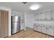 Spacious kitchen with stainless steel fridge and plenty of cabinet space at 112 E Marland Ct, Nokomis, FL 34275