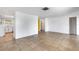 Bright, spacious living area leads to kitchen and bath and features tile floors at 112 E Marland Ct, Nokomis, FL 34275