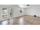 Inviting living room features tile floors, glass doors, and a bright window with natural light at 112 E Marland Ct, Nokomis, FL 34275