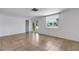 Bright living room with tile flooring, a closet, a window, and glass doors leading outside at 112 E Marland Ct, Nokomis, FL 34275