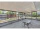 A screened-in patio provides a relaxing spot with a view of the fenced yard at 112 E Marland Ct, Nokomis, FL 34275