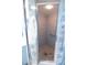 A shower featuring patterned blue wallpaper at 1279 Vermeer Dr, Nokomis, FL 34275
