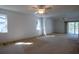 Spacious bedroom with carpet floors, ceiling fans, and views of the pool area at 1279 Vermeer Dr, Nokomis, FL 34275