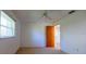 Bedroom with a ceiling fan, window, and a door to another room at 1279 Vermeer Dr, Nokomis, FL 34275