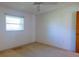Bedroom featuring a window and a doorway to another room at 1279 Vermeer Dr, Nokomis, FL 34275