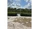 Community dock providing water access with lush greenery, great for peaceful walks along the waterway in the area at 1279 Vermeer Dr, Nokomis, FL 34275