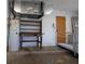 Attached garage with ramp, water heater, and shelving at 1279 Vermeer Dr, Nokomis, FL 34275