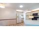 Open kitchen with updated appliances, hardwood flooring, adjacent to an eat-in dining area for convenient living at 1279 Vermeer Dr, Nokomis, FL 34275