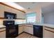 Efficiently designed kitchen with modern appliances, offering a comfortable space for cooking and daily living at 1279 Vermeer Dr, Nokomis, FL 34275
