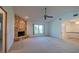 Bright living room with a stone fireplace and access to other rooms at 1279 Vermeer Dr, Nokomis, FL 34275