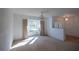 Spacious living room featuring a bay window, providing ample natural light and a pleasant view of the surroundings at 1279 Vermeer Dr, Nokomis, FL 34275