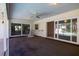 Covered patio with ceiling fan, sliding doors, and access to the pool at 1279 Vermeer Dr, Nokomis, FL 34275