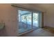 Sliding glass doors opening to a screened patio and pool area at 1279 Vermeer Dr, Nokomis, FL 34275