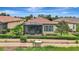 Beautiful screened lanai and landscaped backyard of a lovely home, perfect for relaxing outdoors at 13108 Torresina Ter, Bradenton, FL 34211