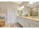 Bright bathroom with double vanity, glass enclosed shower, and tile flooring at 13108 Torresina Ter, Bradenton, FL 34211