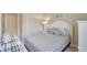 Bright bedroom featuring coastal décor, a comfortable bed, and white furniture for a tranquil atmosphere at 13108 Torresina Ter, Bradenton, FL 34211