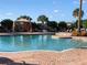 Sparkling community pool with comfortable lounge chairs and a shaded cabana for relaxation at 13108 Torresina Ter, Bradenton, FL 34211