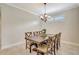 Formal dining room with a wooden table, seating for six, and elegant chandelier lighting at 13108 Torresina Ter, Bradenton, FL 34211