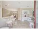 Welcoming entryway featuring a breakfast bar, white cabinetry, and a built-in desk at 13108 Torresina Ter, Bradenton, FL 34211