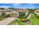 Beautiful single-Gathering home with a well-manicured lawn, mature landscaping, and a brick driveway at 13108 Torresina Ter, Bradenton, FL 34211
