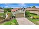 Charming single-Gathering home with a well-manicured lawn, mature landscaping, and a two-car garage at 13108 Torresina Ter, Bradenton, FL 34211