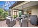 Comfortable outdoor living space with patio furniture, a grill, and access to the home's interior at 13108 Torresina Ter, Bradenton, FL 34211
