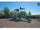 Community playground with slide, climbing structures, and safety surfacing for to enjoy at 13108 Torresina Ter, Bradenton, FL 34211