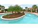 Beautifully landscaped community pool with seating, cabana and tropical greenery at 13108 Torresina Ter, Bradenton, FL 34211