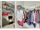 Spacious walk-in closet featuring organized storage solutions, shelving, and clothing racks for convenience at 13108 Torresina Ter, Bradenton, FL 34211