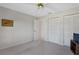 Bedroom with neutral paint, carpet, ceiling fan, and closet space at 1654 Waxwing Ct, Venice, FL 34293