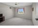 A bedroom with neutral paint, carpet flooring, a ceiling fan, and a window at 1654 Waxwing Ct, Venice, FL 34293
