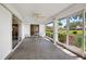 Enclosed lanai with tile floors and beautiful views of the manicured lawn and waterfront at 1654 Waxwing Ct, Venice, FL 34293