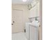 Convenient laundry area with a washer, dryer, storage cabinets, and door to the exterior at 1654 Waxwing Ct, Venice, FL 34293