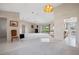 Bright, airy living room with tile entry, carpeted living space, and sliding doors to the lanai at 1654 Waxwing Ct, Venice, FL 34293
