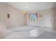 Living room with tiled entryway, neutral walls, and window with valance at 1654 Waxwing Ct, Venice, FL 34293