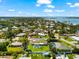 A screened-in pool and green lawn highlight this charming one-story home nestled within a tranquil residential community at 1723 Laramie St, Sarasota, FL 34231