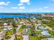 Aerial shot of a home with a pool nestled in a residential area near a beautiful waterfront at 1723 Laramie St, Sarasota, FL 34231
