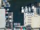 Overhead view of a marina with boats docked, beach chairs, and patio furniture on a sunny day at 1723 Laramie St, Sarasota, FL 34231
