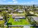 A lovely one-story home has a screened-in pool with spacious, fenced-in backyard with lush landscaping at 1723 Laramie St, Sarasota, FL 34231