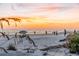 Beach at sunset with people enjoying the scenery and ocean waves at 1723 Laramie St, Sarasota, FL 34231