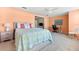 Bedroom with a bed with a quilt with a beach motif, desk, and view to another room at 1723 Laramie St, Sarasota, FL 34231