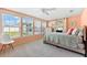 Bright bedroom with a large window and a bed with a quilt with a beach motif at 1723 Laramie St, Sarasota, FL 34231