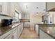 Bright kitchen with granite countertops, stainless steel appliances and lots of counter space for cooking at 1723 Laramie St, Sarasota, FL 34231