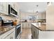 Bright kitchen featuring granite countertops, stainless steel appliances and ample cabinet space at 1723 Laramie St, Sarasota, FL 34231