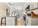 Spacious kitchen flows into the dining area featuring granite counters, stainless appliances and ample storage at 1723 Laramie St, Sarasota, FL 34231
