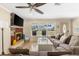 Relaxing living room featuring a fireplace, comfortable seating, and a view of the entry at 1723 Laramie St, Sarasota, FL 34231