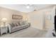 Relaxing living room with a comfortable sofa, ceiling fan, and a view into the entry way at 1723 Laramie St, Sarasota, FL 34231