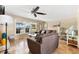 Inviting living room with neutral decor, tile floors, and comfortable furniture at 1723 Laramie St, Sarasota, FL 34231