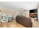 Comfortable living room featuring a fireplace and plush seating, perfect for relaxing or entertaining at 1723 Laramie St, Sarasota, FL 34231